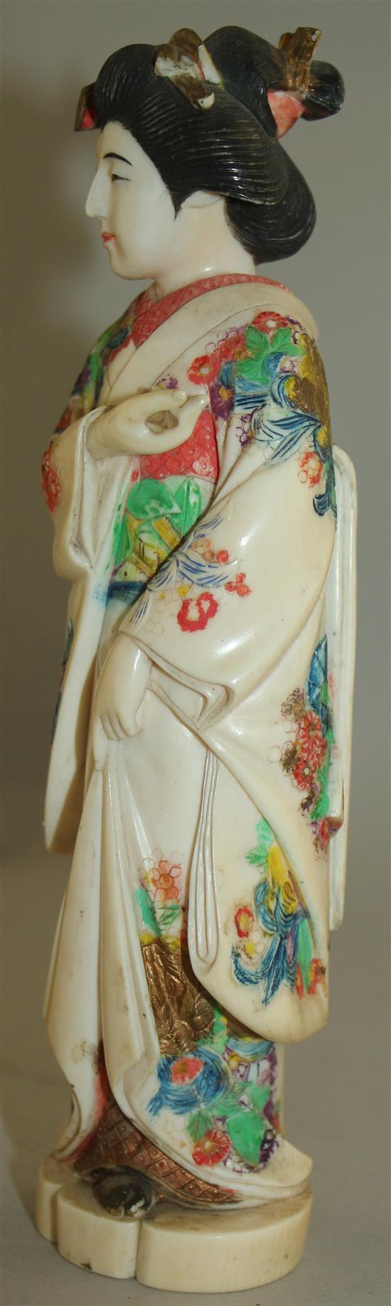 A Japanese coloured ivory figure of a bijin, early 20th century, 21cm